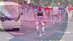 Watch: Runners v robots at China half marathon