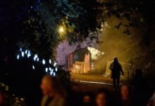 A woman walks on the grounds of Slane Castle during a Halloween festival called 'Puca' celebrating the Celtic