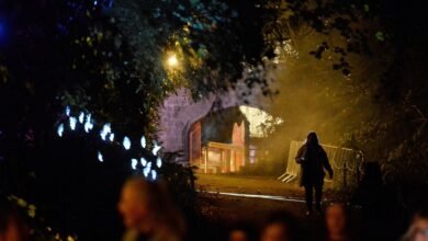 A woman walks on the grounds of Slane Castle during a Halloween festival called 'Puca' celebrating the Celtic