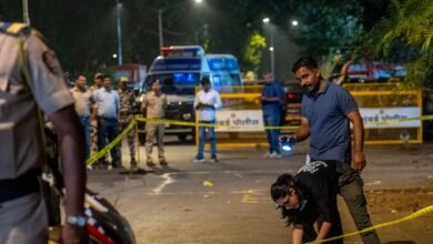 Forensic Experts and Police collect samples of evidence from the spot where unidentified assailants fired at Tiger Shroff